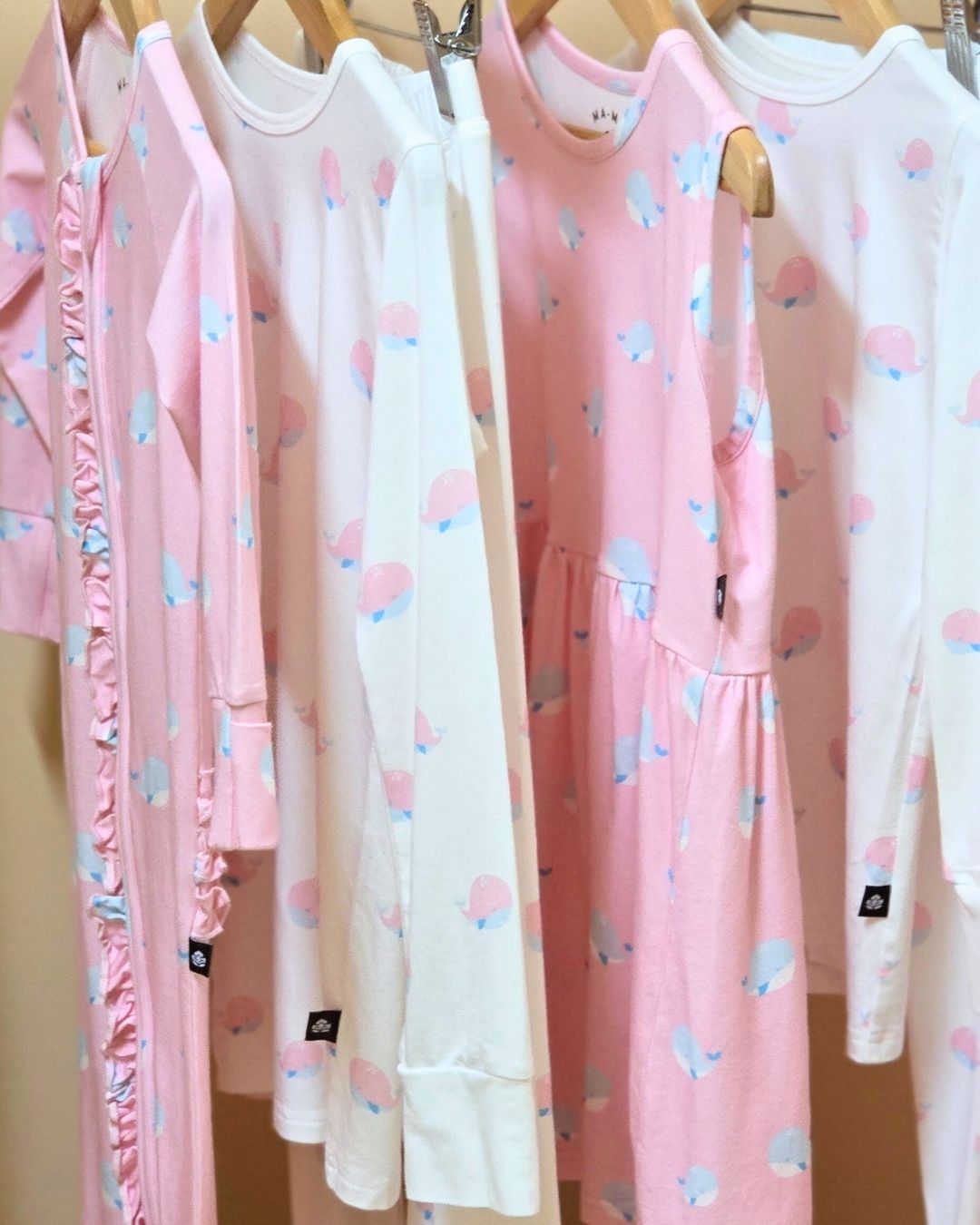 Kids bamboo pajamas Sea Breeze by MA-MA NYC hanging on a rack.